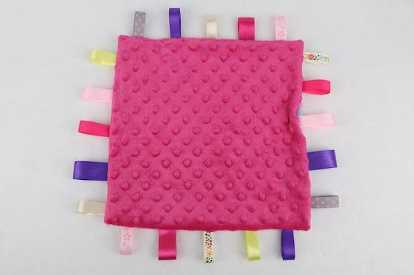 Image shows the sewn lovey tag blanket, Minky side showing.