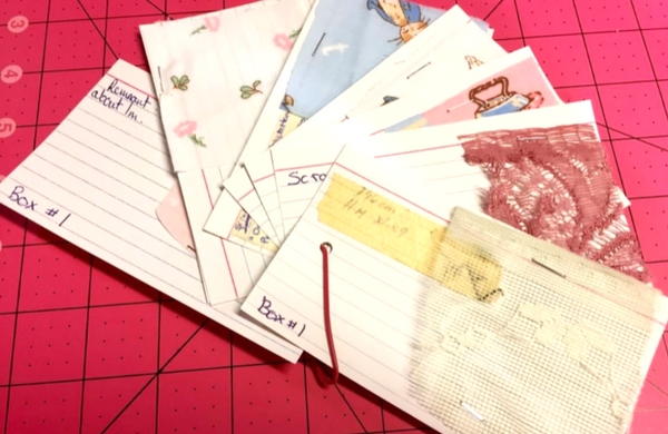 Fabric samples on notecards with information