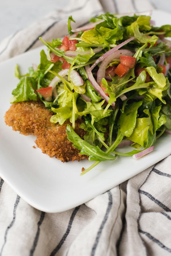 Veal Milanese with Arugula Tomato and Red Onion Salad