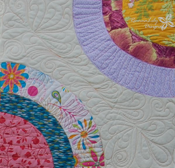 Image shows a close-up of Jen's Scrappy Circles Quilt.