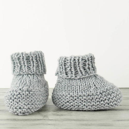 white knitted baby booties