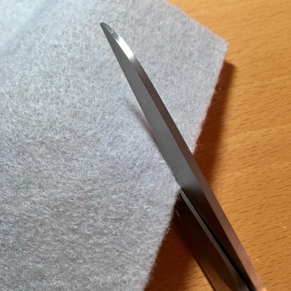 An image of fabric scissors cutting craft felt