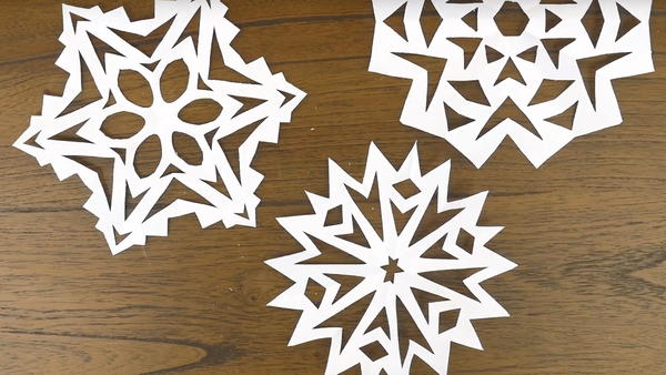 How to Make Easy Paper Snowflakes | FaveCrafts.com