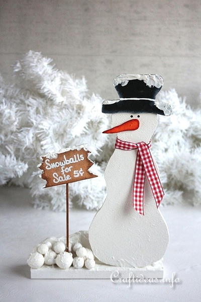 Wooden Snowman Selling Snowballs