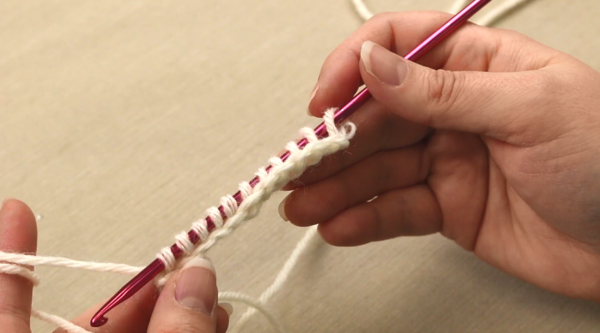 Image shows the second step in Tunisian crochet: the forward pass.