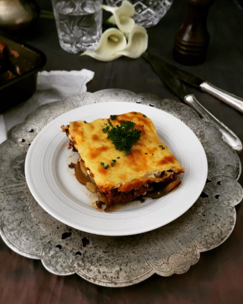 Layered moussaka in baking dish