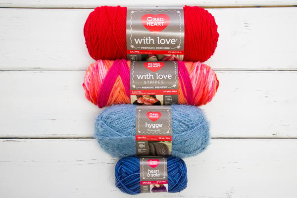 Example of four small to large Red Heart Yarn skeins.