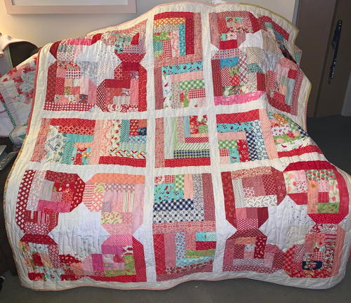 A Scrappy Log Cabin Flower Hearts Quilt