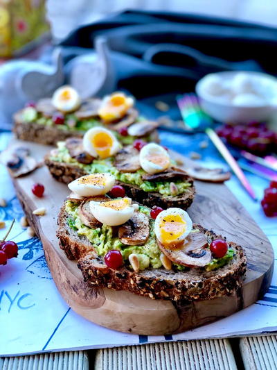 Soft Boiled Quail Eggs, Avocado Butter and Red Currant on Sourdough Toast