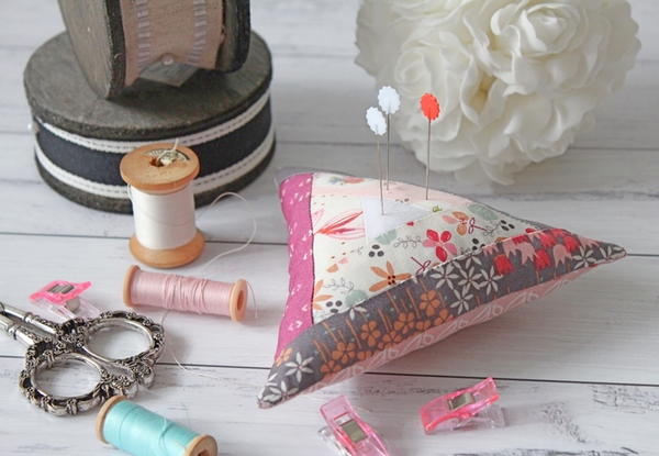 Reignite Your Creative Spark - image shows a sewn pincushion surrounded by sewing supplies.