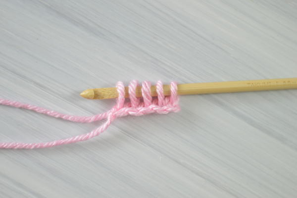 Images show step 4 for how to Tunisian crochet.