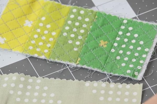 Image shows a crosshatch stitched quilting design on the DIY pin cushion fabric.