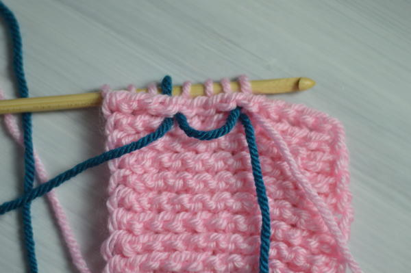Image shows an example of what the back would look like for carrying colors in Tunisian crochet.