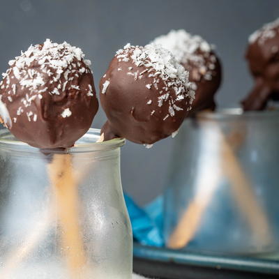 Cheesecake Cake Pops Coated In Dark Chocolate & Coconut