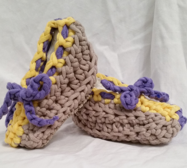 Image shows one pair of the quick crochet slippers.