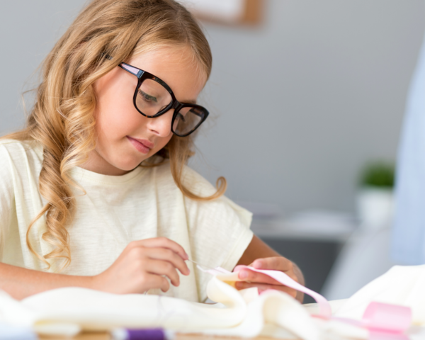 Little Girl Sewing