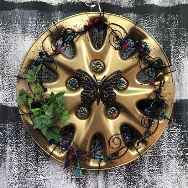 Radiant Black Butterfly Hubcap Art