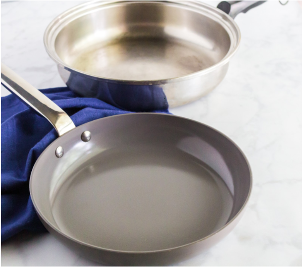 A ceramic pan and a stainless steel pan