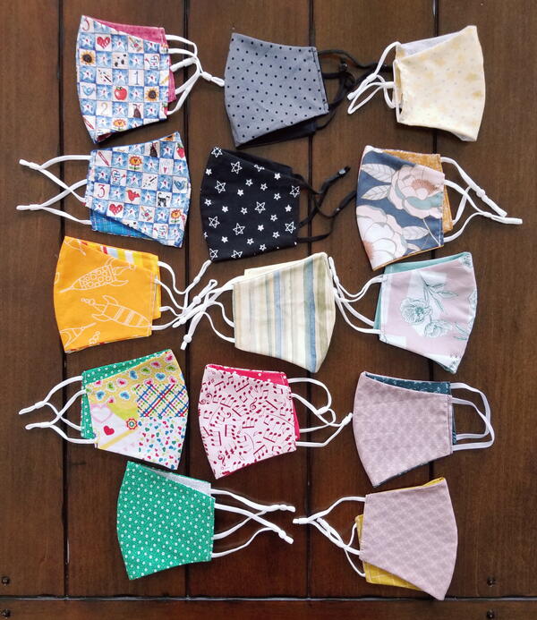 Image shows several finished child size fabric face masks.