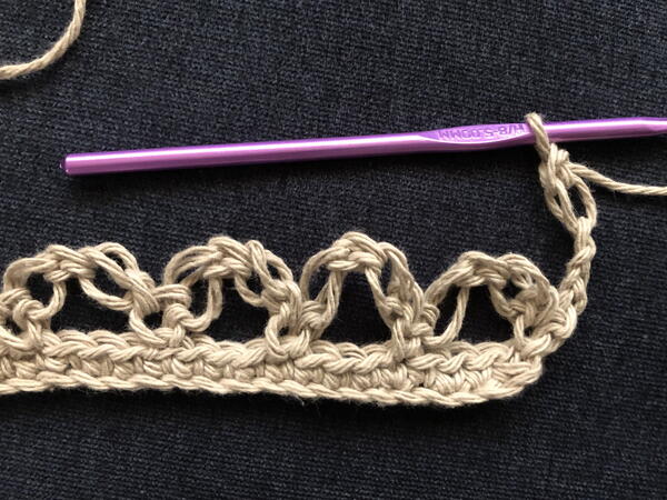 Image shows step 1 for a new row for crocheting the Solomon's Knot stitch.