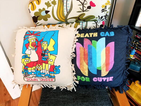 Image shows two t-shirt pillows.