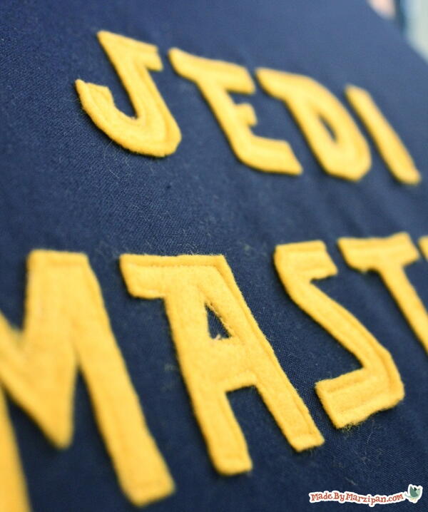 Image shows a close-up of the yellow Jedi Master lettering on the DIY seat cushion.