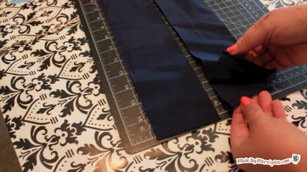 Image shows the four straps cut and on a self-healing mat. Hands are showing the strap underneath the other.