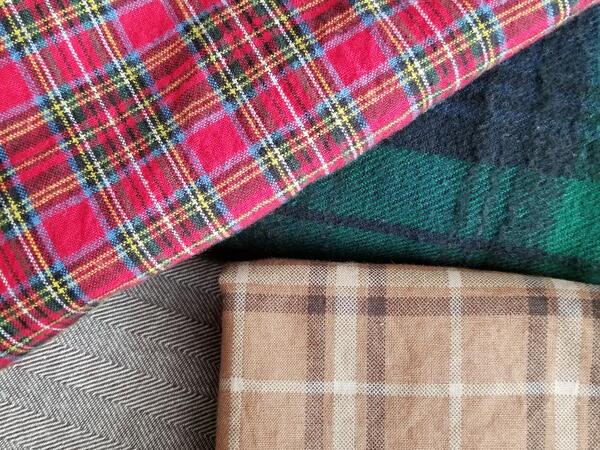 Image shows four different flannel fabrics.