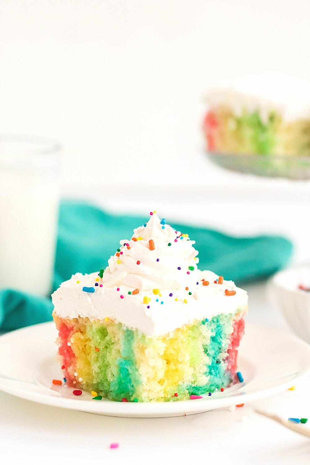 Rainbow Poke Cake | FaveSouthernRecipes.com