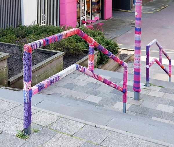 Yarn bombing on a staircase.