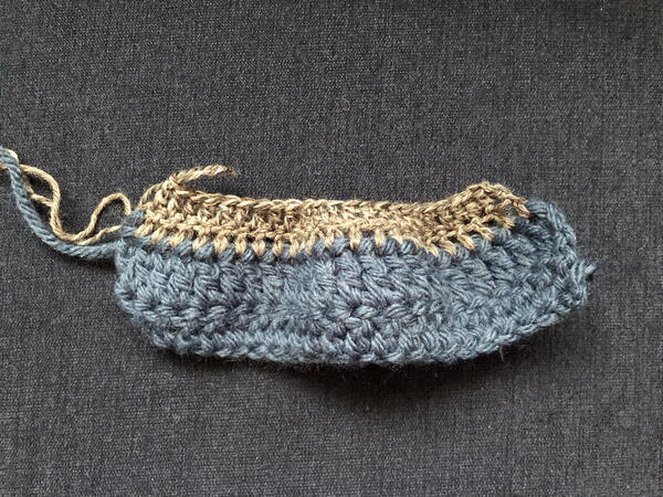 Image shows how NOT to crochet wuth different yarn weights by using different hooks that end up causing a curl.