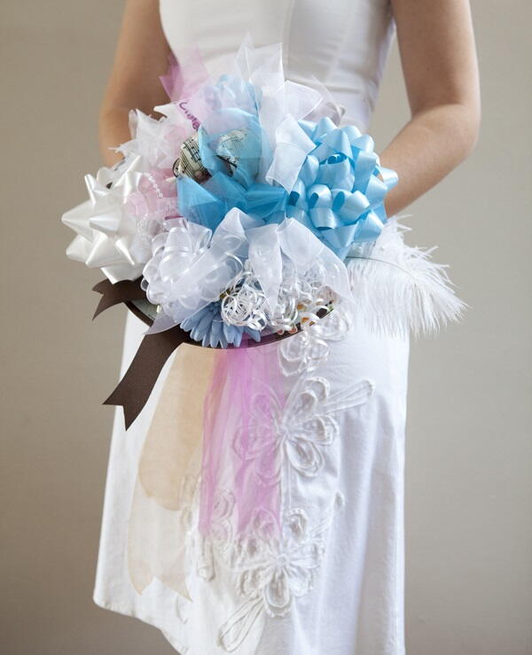 Bridal shower bouquet using all the wrapping paper, ribbons & tissue paper  from the gifts received. To …