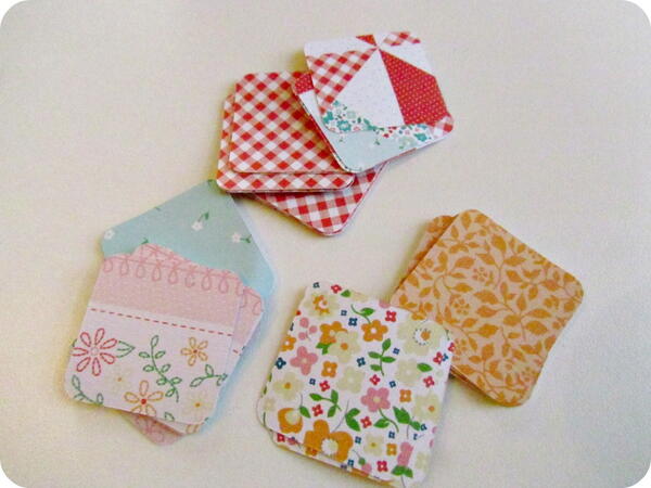 Cut out squares of pretty scrapbooking paper.