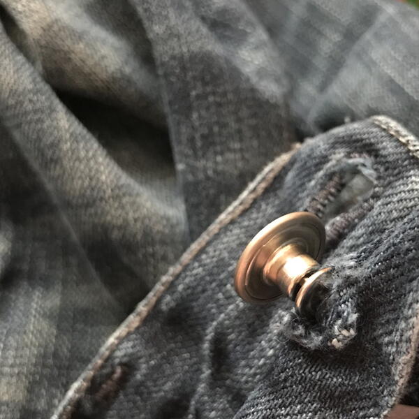 Jean button fly that needs repairing