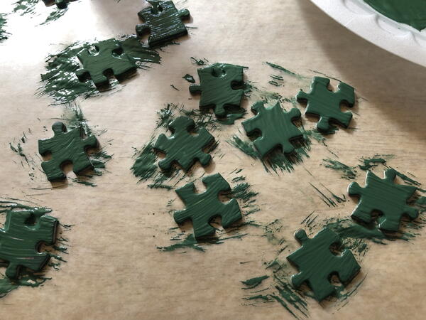 Paint the puzzle pieces green