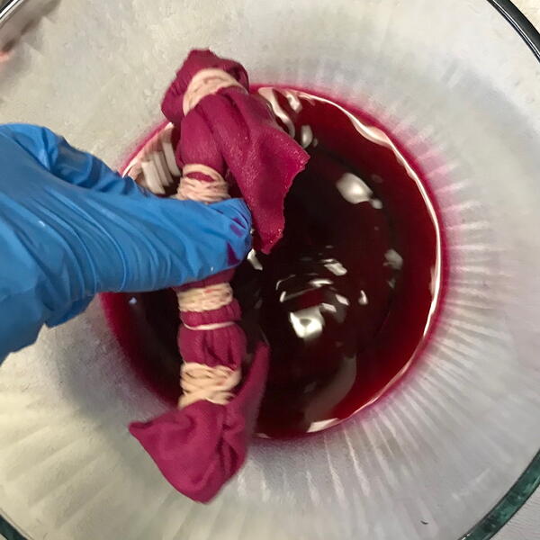 Allow excess liquid to drip back into the dye bowl.