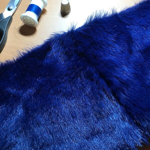 Image shows faux fur fabric, from the front, and sewn