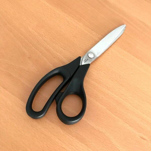 Image shows a pair of fabric scissors.