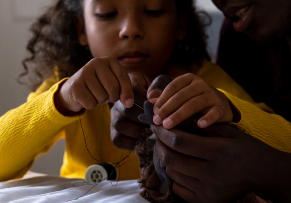 Little Girl Sewing With Her Dad