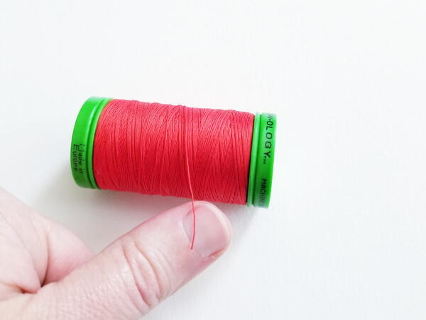 Threading a sewing needle: finding the end in a spool of thread