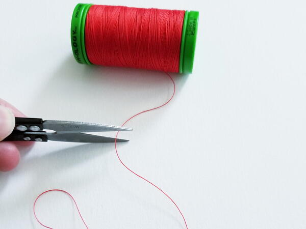 How to Thread a Needle for Hand Sewing | AllFreeSewing.com