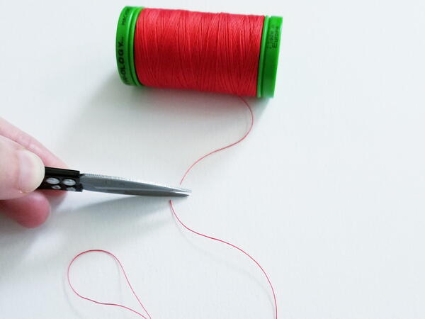 How to Thread a Needle for Hand Sewing | AllFreeSewing.com