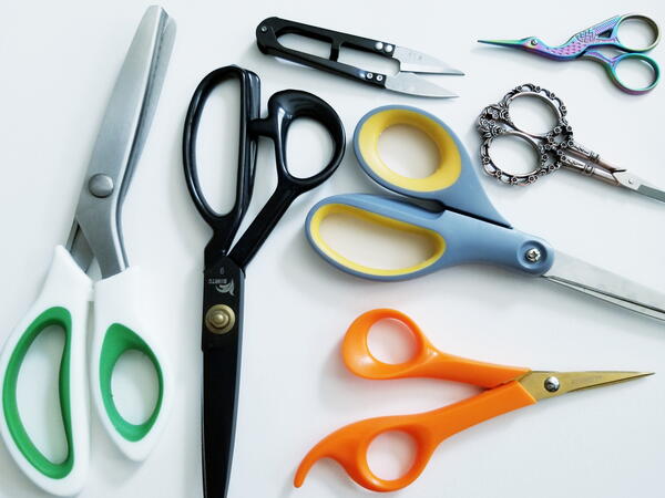 Image shows various pairs of scissors for all types of cutting.