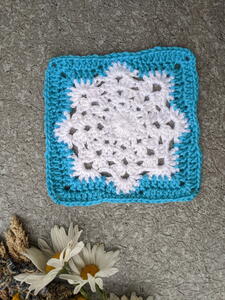 Granny Square With A Snowflake | AllFreeCrochet.com