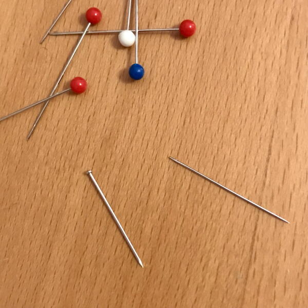 Be careful when putting sewing pins in your mouth and be sure to organize them instead of what you see here.