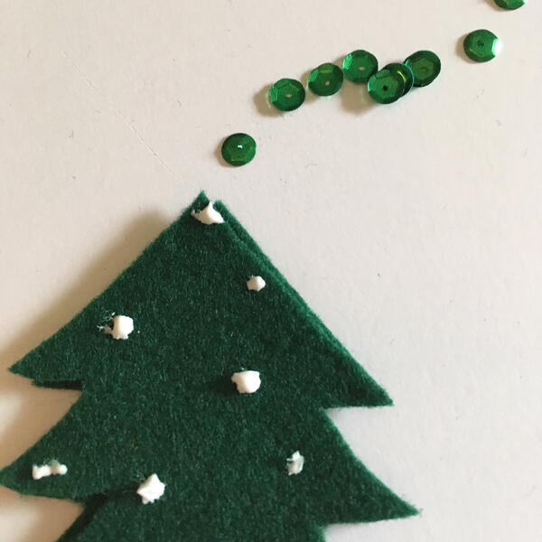 Image shows step 8 for making the Scandinavian Christmas Garland.