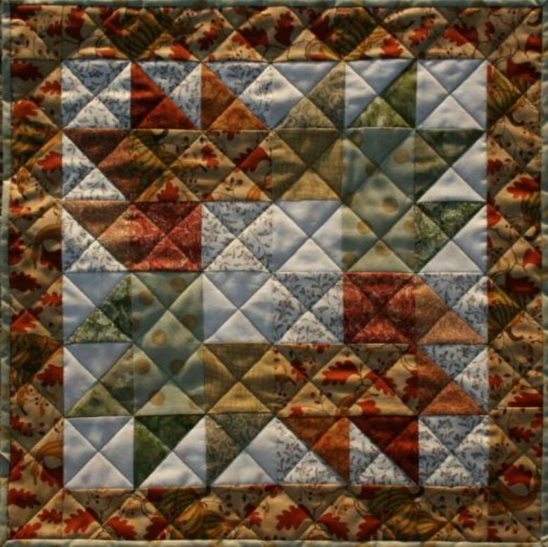 maple-leaves-quilted-thanksgiving-table-topper-pattern-favequilts-com
