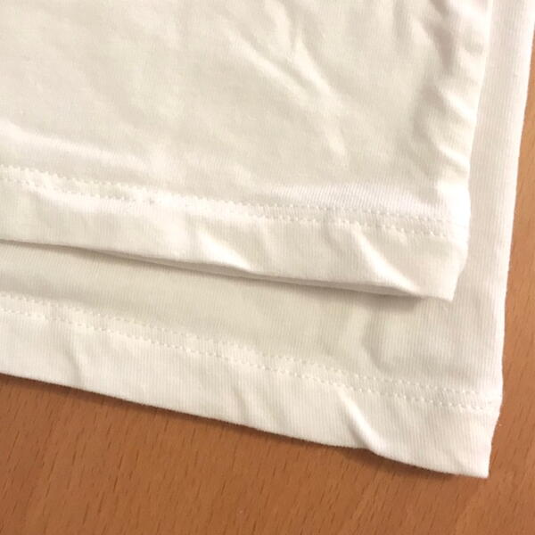 Clothes shrink in dryer at times when the heat is too high or the materials get damaged. Image shows two white shirts layered and the one on top has been shrunk.