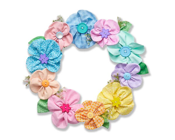 Image shows the finished May Flowers Spring Wreath DIY on a white background.