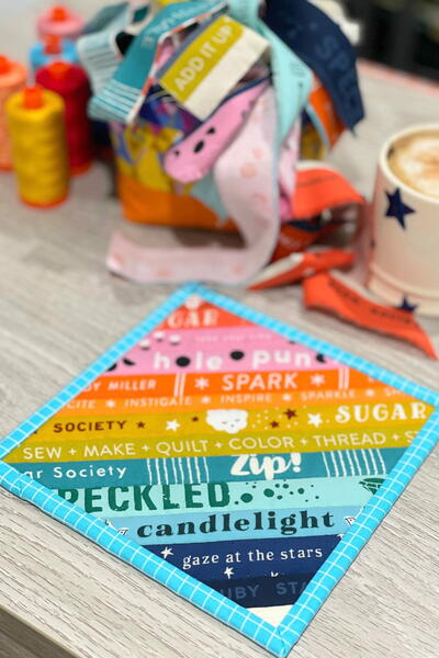 Scrappy Stack Mug Rug Pattern | FaveQuilts.com